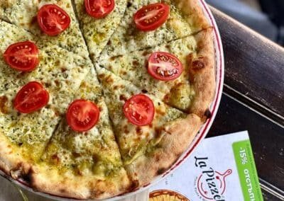 pizza with cheese tomatoes pesto